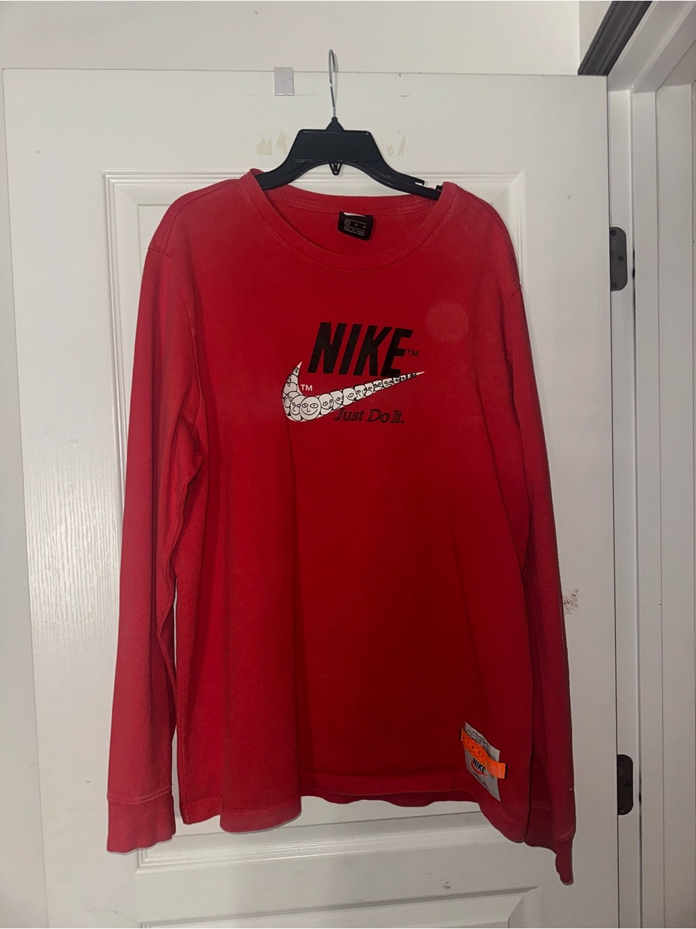 Nike Red Long Sleeve Shirt with Black Logo and White Patterned Swoosh